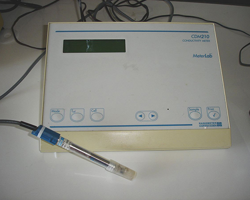 An electrical conductivity meter is used to measure total dissolved solids
